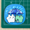 Bunny and Froggy Shopping In Rain Vinyl Sticker